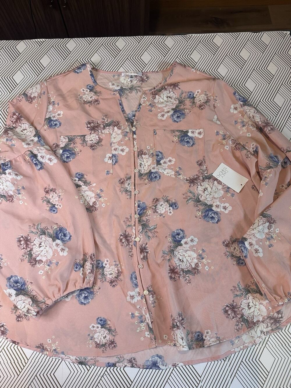 Daily Thread mauve floral blouse features long balloon sleeves/button-down front
